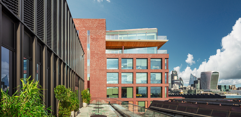 Rooftop terrace at MYO Bankside overlooking London's skyline with outdoor seating and planting.