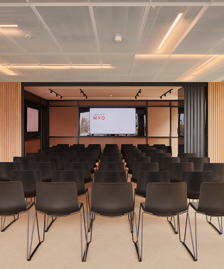 Event space at MYO Liverpool Street arranged in theatre style with presentation screens, flexible seating and contemporary interiors for corporate events and workshops.