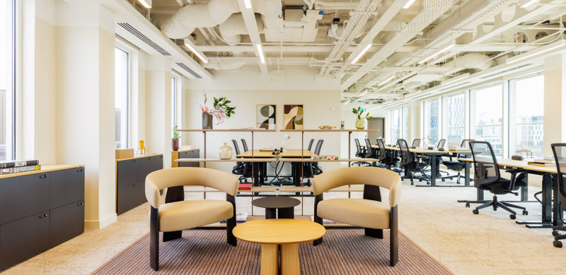 Open-plan workspace at MYO King's Cross featuring shared desks, breakout seating and abundant natural light.