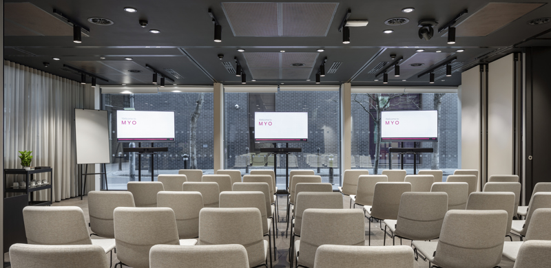 Event suite at MYO Bankside arranged in theatre style with presentation screens and seating.