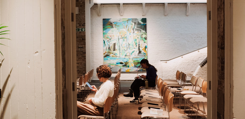 Bright conference space with a pop of modern art